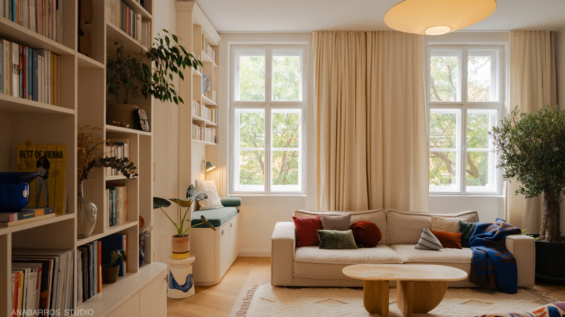 Warm living room with custom shelving in the Porzellangasse Apartment