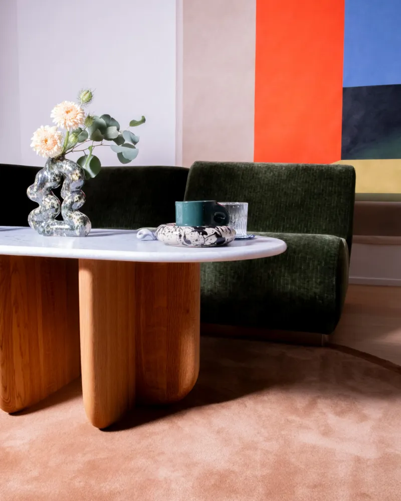 Antibes coffee table with green marble top in a styled interior