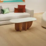 Antibes coffee table with a Verde Pinta marble top in a bright living room