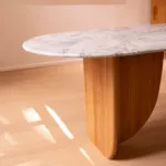 Wood support beneath the white marble Antibes dining table top